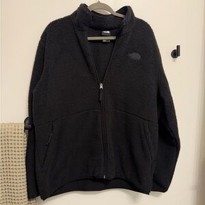 Black fuzzy north face jacket